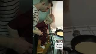 Quinn making, flipping pancakes…