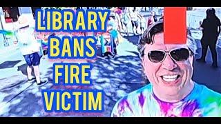 FIRE VICTIM BANNED FROM LIBRARY FOR A YEAR