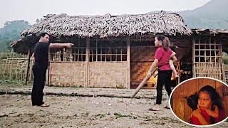 The angry girl swung a stick and hit her father-in-law to save her daughter