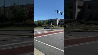 Lamborghini Huracán flyby at car show.