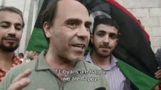 Libyans in Tunisia react to reports of Muammar Gaddafi's death