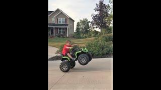 3 year old does wheelie on 4-Wheeler