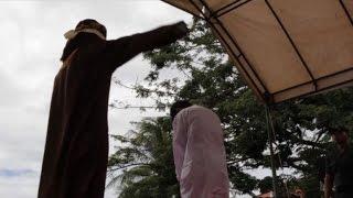 Indonesian men caned for gay sex before jeering crowd