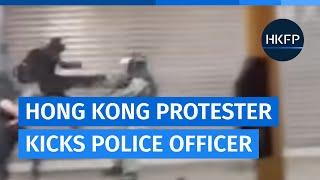 Hong Kong protesters attack riot police officer with flying kick