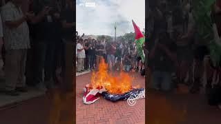 Protesters burn American flag