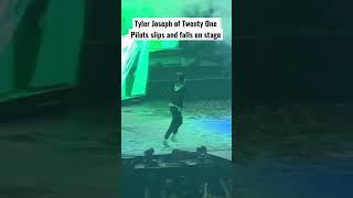 Tyler Joseph of @twentyonepilots  slips and falls on stage