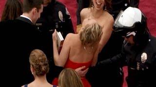 Jennifer Lawrence FALLS on Oscars Red Carpet 2014!