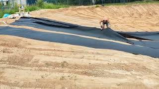 Laying  down pond liner in a huge pond #ponds #pondbuilders #pondbuild #pondliner