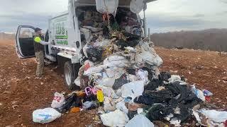 8 yard Curbtender Quantum dumping 7120 pounds of trash at the landfill