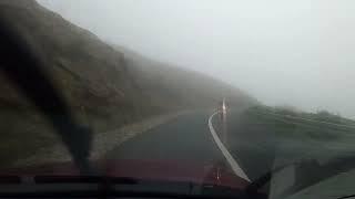 Driving Keem Strand - Keel Mountain Road in Achill Island during cloudy conditions.