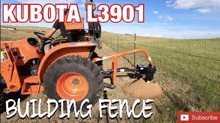 Kubota L3901 Building Fence with LandPride PD15 Auger