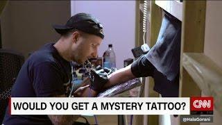 Famed tattoo artist gives away free mystery tattoos