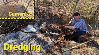 Unclogging Stream Bed To Drain Flooded Culvert Pipe