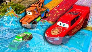 Disney Pixar Cars fall into the water: Lightning McQueen, Jackson Storm, Doc Hudson, Miss Fritter