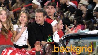 Jeremy Renner is all smiles with his family at the Hollywood Christmas Parade in Los Angeles