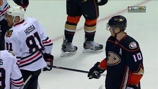 Perry tries to steal Hossa’s stick