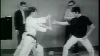 Bruce Lee - demonstrating feats of strength in Hong Kong