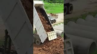 Dump Truck Pouring Sticky Soil