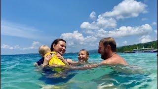 Swimming for the first time on a Philippine beach/the water is crystal clear/ my family is delighted