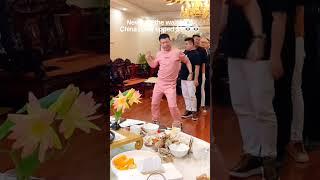Chinese waiters dancing after tip