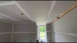 Taping drywall in a addition.