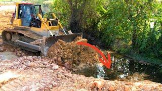 Wonderful Stronger Bulldozer KOMATSU DX65P Working push soil filling up/Heavy Dump truck unloading.