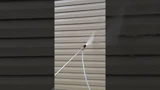 Using the adjustable M5 X-Jet with low psi. Soft wash technique to avoid damaging siding.