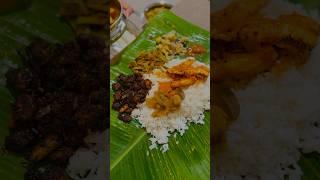 Spicy fish curry, flavorful prawns roast, and an array of vibrant thoran served with steamed rice!