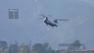 Chinook Firefighting Helicopter Arriving at a Reservoir to Refill Water Tank