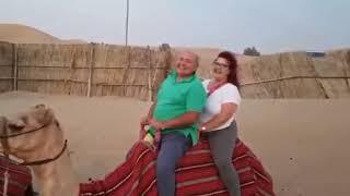 Fat couple on camel