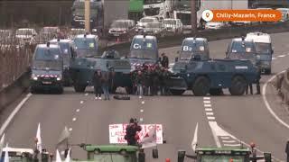 Armored police block French farmers on highway to Paris | REUTERS