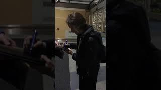 Danielle Panabaker signing autographs at the Vancouver Airport