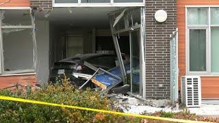 Five sent to hospital after Tesla smashes into living room of Toronto townhome