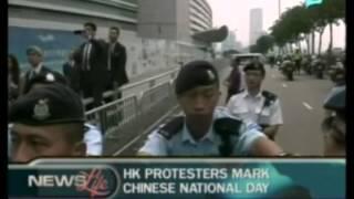 HK protesters mark Chinese national day; Demonstrators burn buddhist temples in Bangladesh