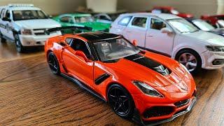 Large diecast cars being driven by hand on the floor  * - MyModelCarCollection