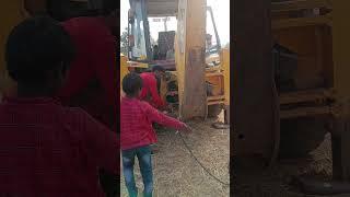 Greasing Backhoe shovel   #mining #jcb #dozercumbackhoe #shorts #viral