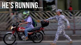 Rider tries to escape enforcers on the EDSA bus lane