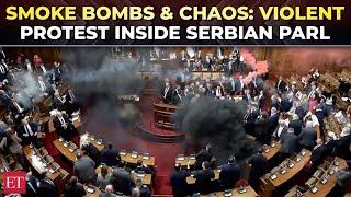 Chaos in Serbian Parliament as opposition MPs hurl smoke grenades to protest govt policies