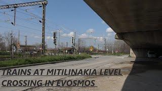 Trains at Mitilinakia level crossing in Evosmos