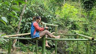 single girl alone - building bamboo house