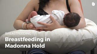 Breastfeeding in madonna hold | Breastfeeding