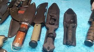 showing off my tactical knife collection