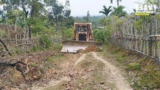 Caterpillar D6R XL bulldozer operator is very good at working to smooth plantation roads