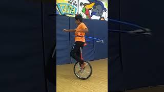 Kid breaks hula hoop record on a unicycle! | Guinness World Records