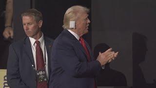 Donald Trump makes first appearance at RNC with bandage on ear after assassination attempt