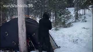 Build a secret warm shelter under a big tree, a mysterious dusty shelter in the snow