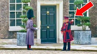 INSIDE TOWER OF LONDON: YEOMAN REMINDS GUARD TO DO HIS JOB