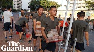 Hong Kong: China deploys troops to help clear roadblocks at university