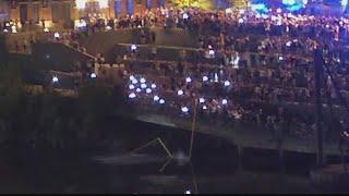 Vanderbilt students walk through Broadway to throw goal posts in the river