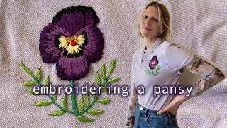 embroidering a pansy on a thrifted polo